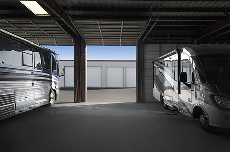 2 RVs parked in the clean, secure, CoachPort RV Indoor Storage Facility 